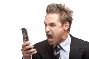 Businessman stressed by mobile phone, The Myndset Digital Marketing